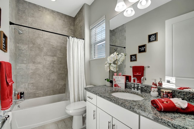 full bathroom featuring shower / bath combo, vanity, and toilet