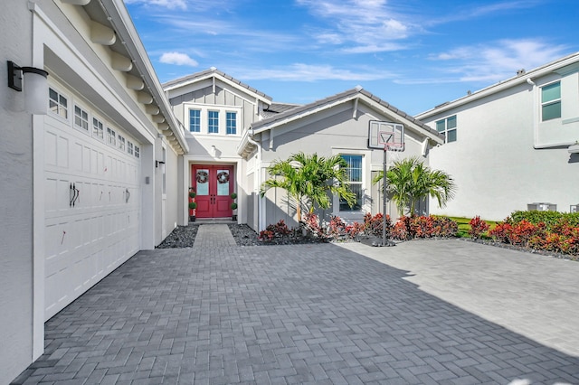 doorway to property featuring a garage