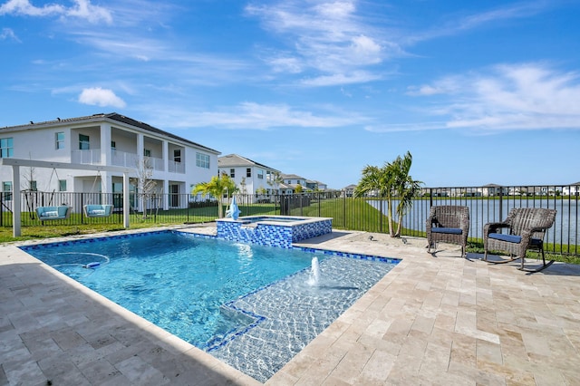 view of swimming pool featuring an in ground hot tub, pool water feature, and a patio