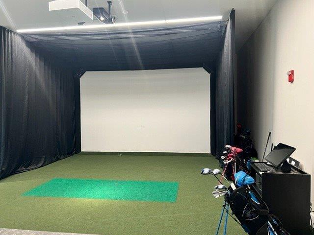 playroom with golf simulator and carpet flooring