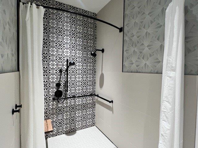 bathroom featuring tile patterned floors and walk in shower