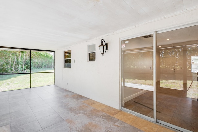 unfurnished sunroom with plenty of natural light