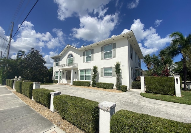 view of front of house with a balcony