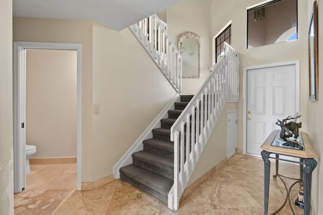 entrance foyer with a textured ceiling