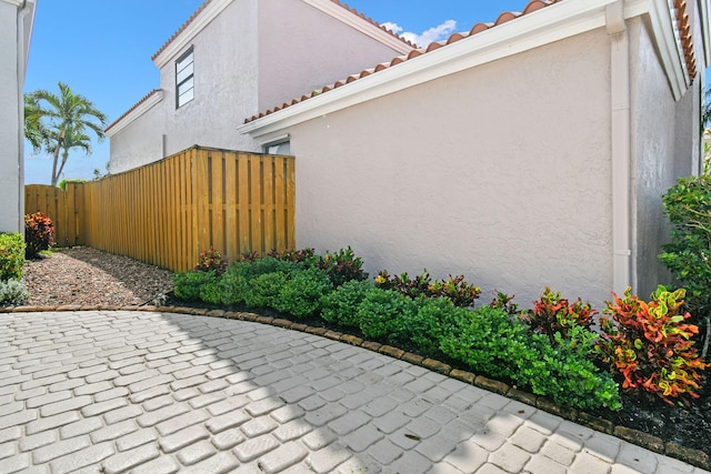 view of side of home featuring a patio area