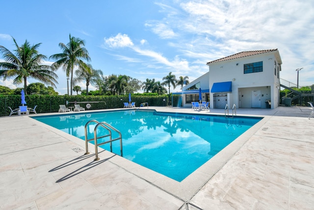 view of swimming pool with a patio area