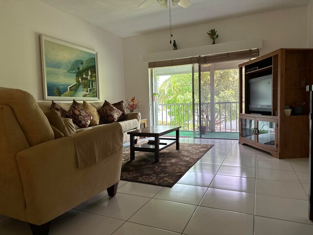 living room with ceiling fan and tile floors