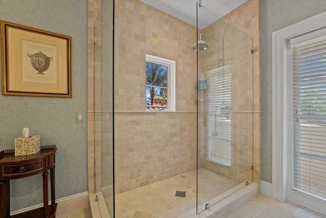 bathroom with tile patterned flooring and a shower with shower door