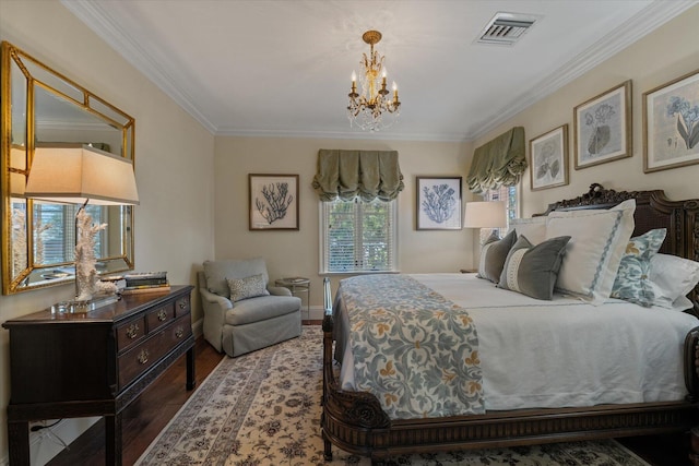 bedroom featuring hardwood / wood-style flooring, an inviting chandelier, and ornamental molding