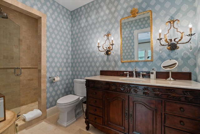 bathroom with vanity, an enclosed shower, and toilet