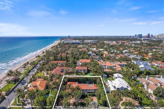 bird's eye view with a water view and a view of the beach