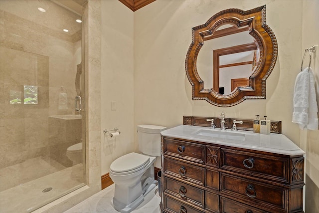 bathroom featuring vanity, toilet, and a shower with door