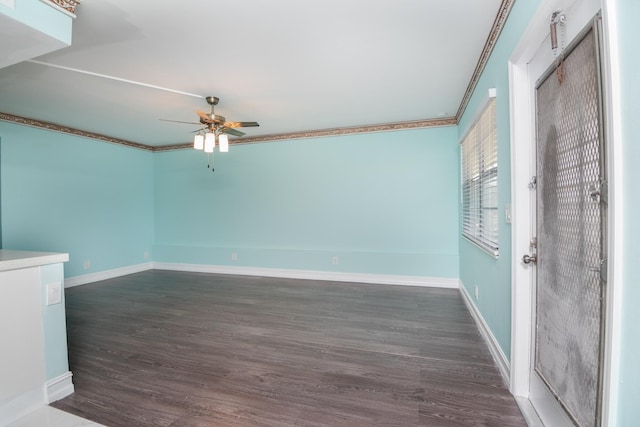 spare room featuring ceiling fan, crown molding, and dark hardwood / wood-style flooring