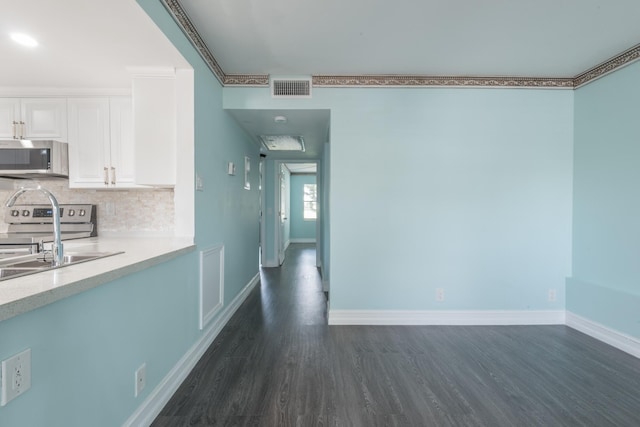 interior space with sink and dark wood-type flooring