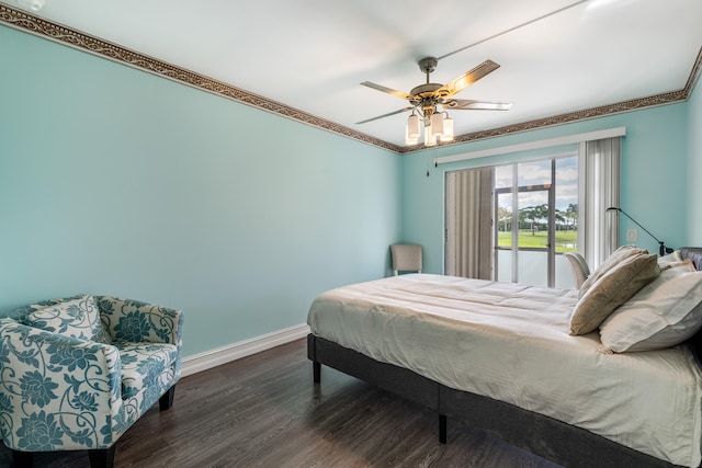 bedroom featuring ceiling fan, dark hardwood / wood-style flooring, crown molding, and access to exterior