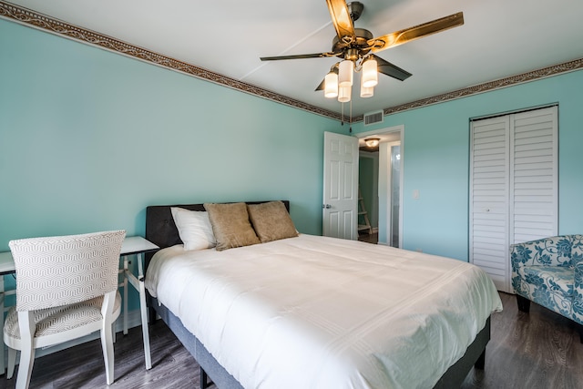 bedroom featuring ceiling fan and dark hardwood / wood-style floors