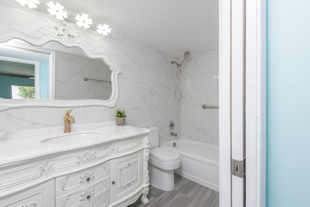 full bathroom with tile flooring, tiled shower / bath, toilet, and large vanity