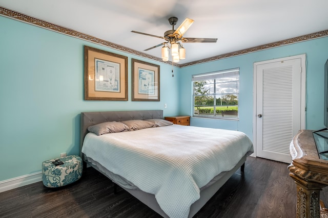 bedroom featuring dark hardwood / wood-style floors and ceiling fan