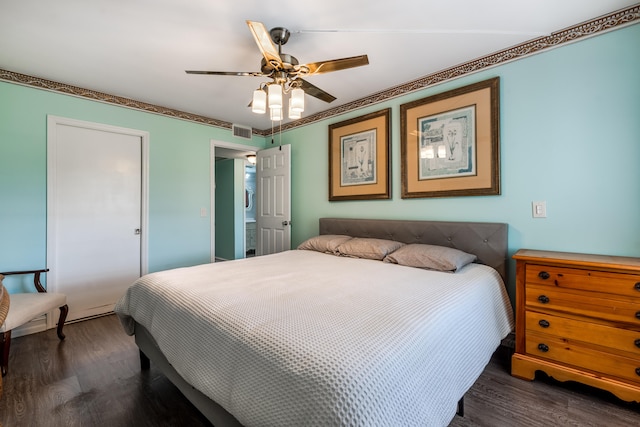 bedroom with ceiling fan and dark hardwood / wood-style flooring