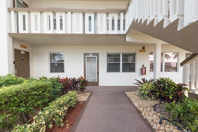 entrance to property with a balcony