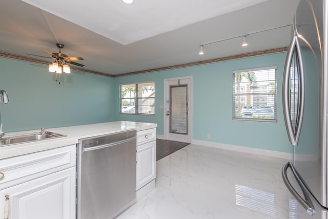 kitchen featuring plenty of natural light, appliances with stainless steel finishes, ceiling fan, and light tile floors