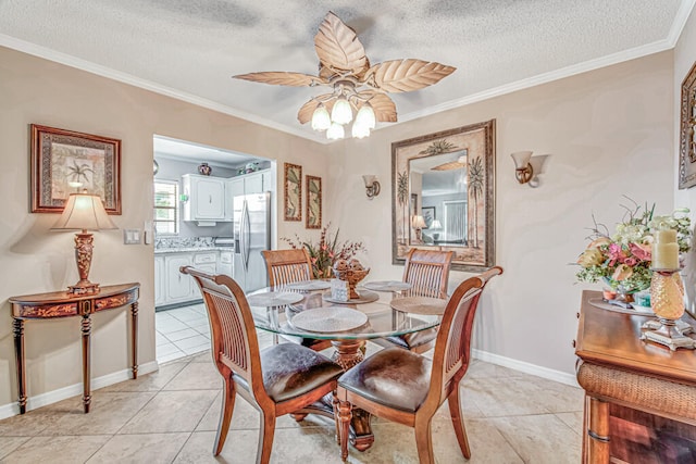 dining area featuring crown molding, ceiling fan, a textured ceiling, and light tile flooring