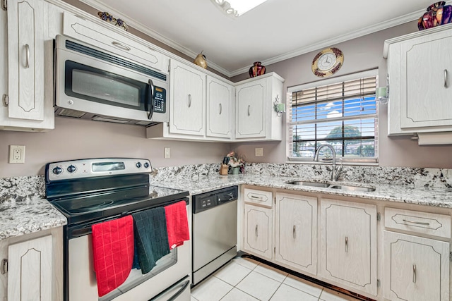 kitchen featuring appliances with stainless steel finishes, sink, light tile flooring, and ornamental molding