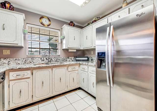 kitchen with light stone counters, light tile floors, sink, crown molding, and stainless steel appliances