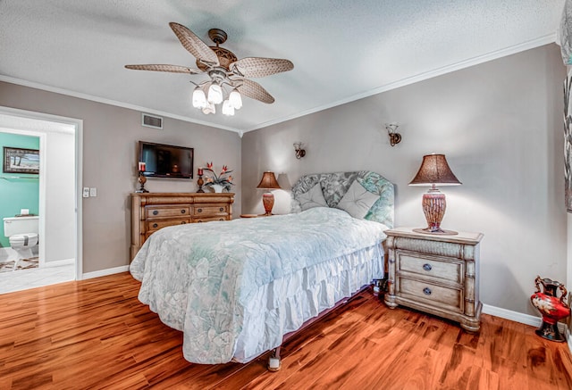 bedroom featuring crown molding, wood-type flooring, ceiling fan, and a textured ceiling