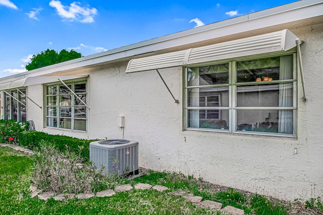 view of property exterior featuring central AC unit