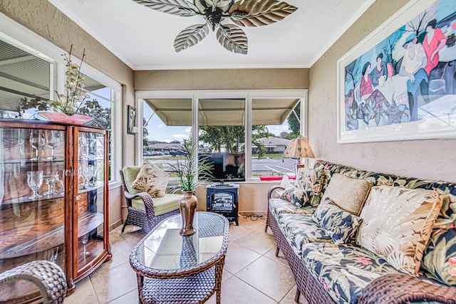 sunroom with plenty of natural light and a wood stove