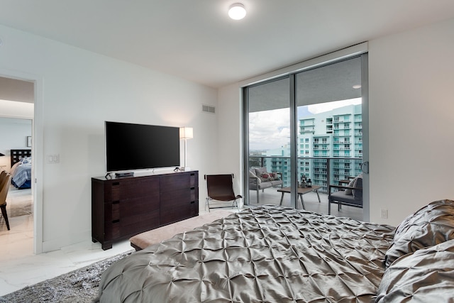 bedroom with floor to ceiling windows, access to outside, and tile flooring