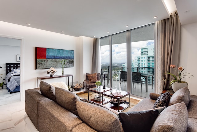 living room featuring floor to ceiling windows and light tile floors