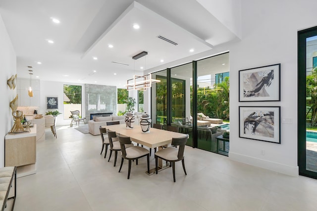 tiled dining area with floor to ceiling windows