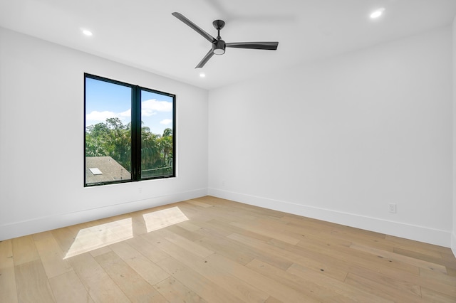 unfurnished room featuring light hardwood / wood-style flooring and ceiling fan