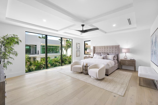 bedroom featuring beam ceiling, ceiling fan, light hardwood / wood-style floors, and coffered ceiling