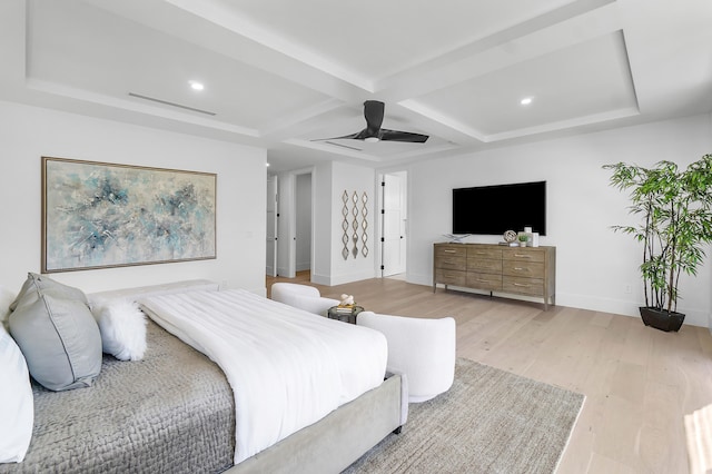 bedroom featuring coffered ceiling, light hardwood / wood-style flooring, beam ceiling, and ceiling fan