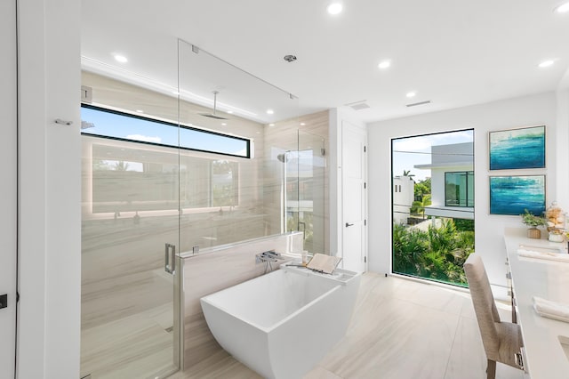 bathroom with tile flooring and independent shower and bath