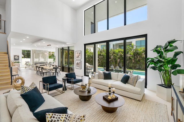 living room featuring a towering ceiling