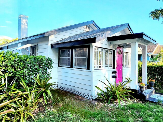 bungalow with a front yard