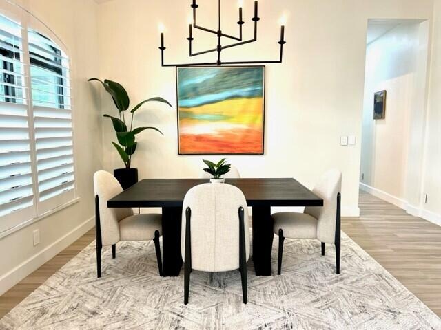 living room featuring ceiling fan and light hardwood / wood-style flooring