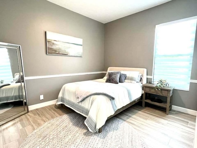 bedroom featuring hardwood / wood-style floors