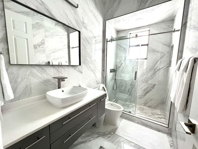 full bathroom featuring toilet, marble finish floor, a marble finish shower, and vanity