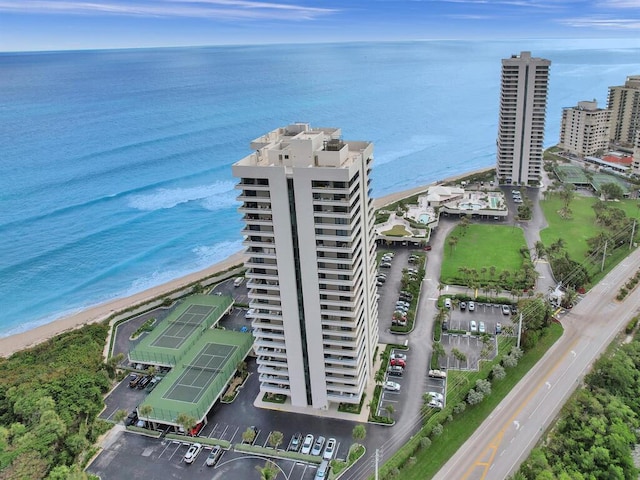 birds eye view of property with a view of the beach and a water view