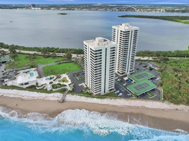 aerial view with a water view and a view of the beach