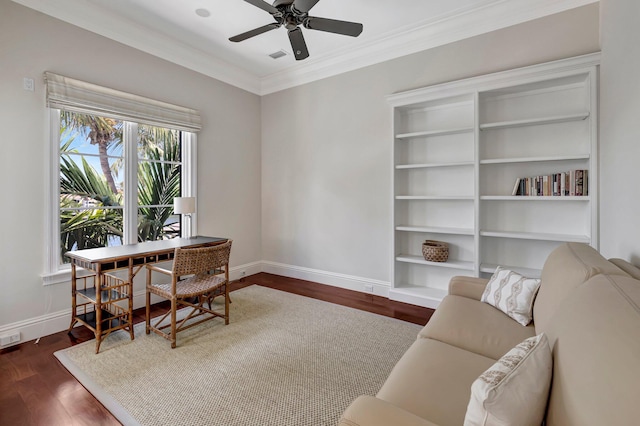 office space featuring dark hardwood / wood-style floors, ceiling fan, and crown molding