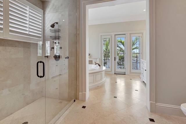 bathroom featuring shower with separate bathtub, tile flooring, and toilet