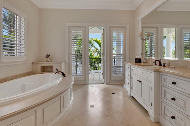 bathroom featuring tile floors, a bathtub, and vanity with extensive cabinet space