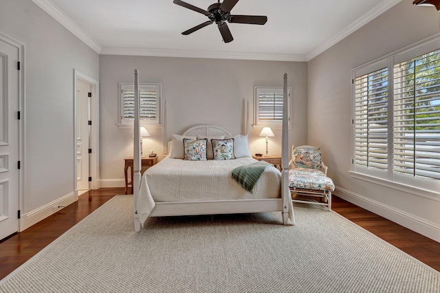 bedroom featuring ceiling fan, dark hardwood / wood-style floors, and crown molding