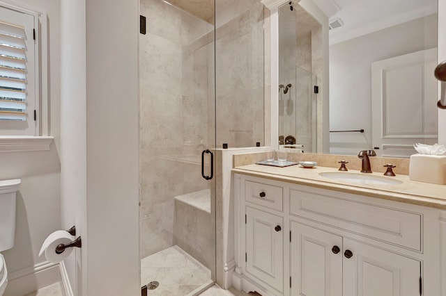 bathroom featuring a shower with door, ornamental molding, toilet, and vanity